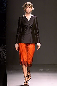 black blazer orange pleated skirt