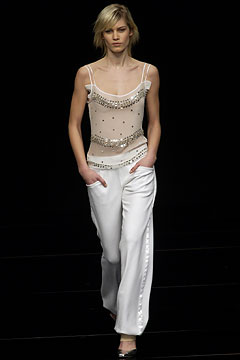 white beaded sleeveless top and wide-leg pants