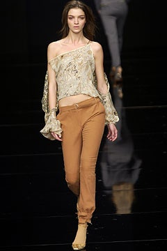 beige silk off-shoulder top with brown pants