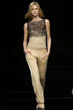 black sheer embellished top with beige pants