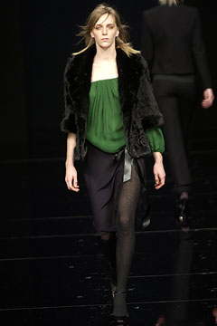green silk top with black skirt