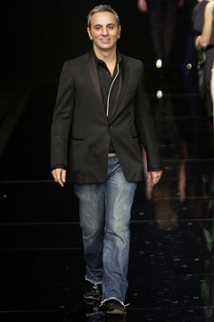 black tailored blazer with blue jeans