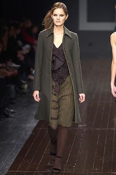 green wool coat and black dress