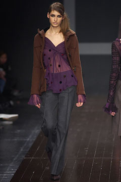 brown jacket purple top gray pants
