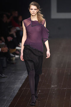 purple silk asymmetric top and black skirt