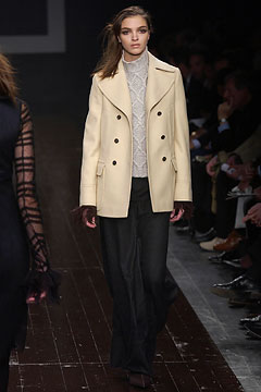 tailored white coat with gray sweater