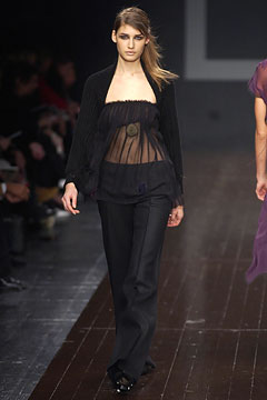 black fitted top and tailored pants