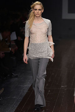 sheer white top with gray pants