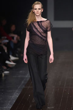 black sheer top and fitted pants