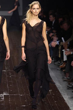 black silk sleeveless dress and leggings