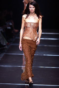 brown leather bustier and lace pants