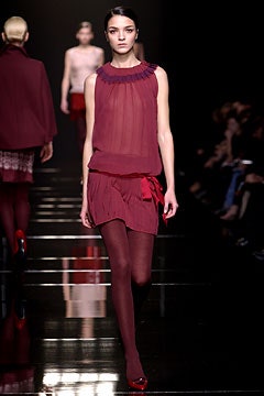 red silk sleeveless high-neck fitted pleated sheer dress