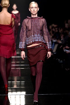 sheer black blouse with maroon skirt