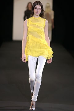 yellow chiffon sleeveless top with white pants
