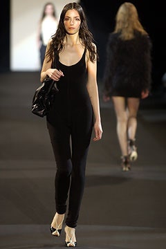 black fitted sleeveless catsuit