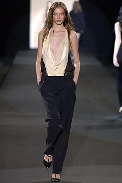 beige silk sleeveless top with black tailored pants