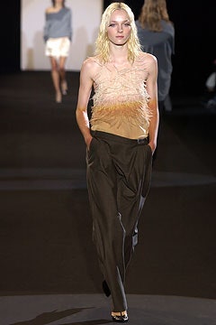 beige feathered top with brown pants