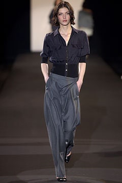 black blouse and gray pants