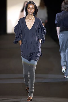 blue silk fitted jumpsuit with gray leggings