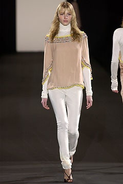 beige silk fitted top with white pants