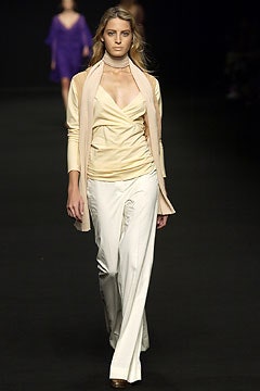 beige silk fitted top with white pants