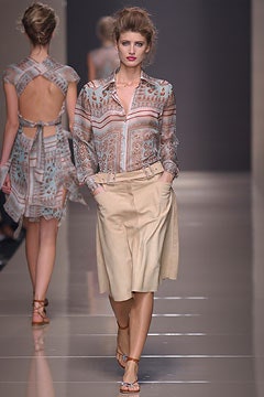 multi printed silk shirt and beige shorts
