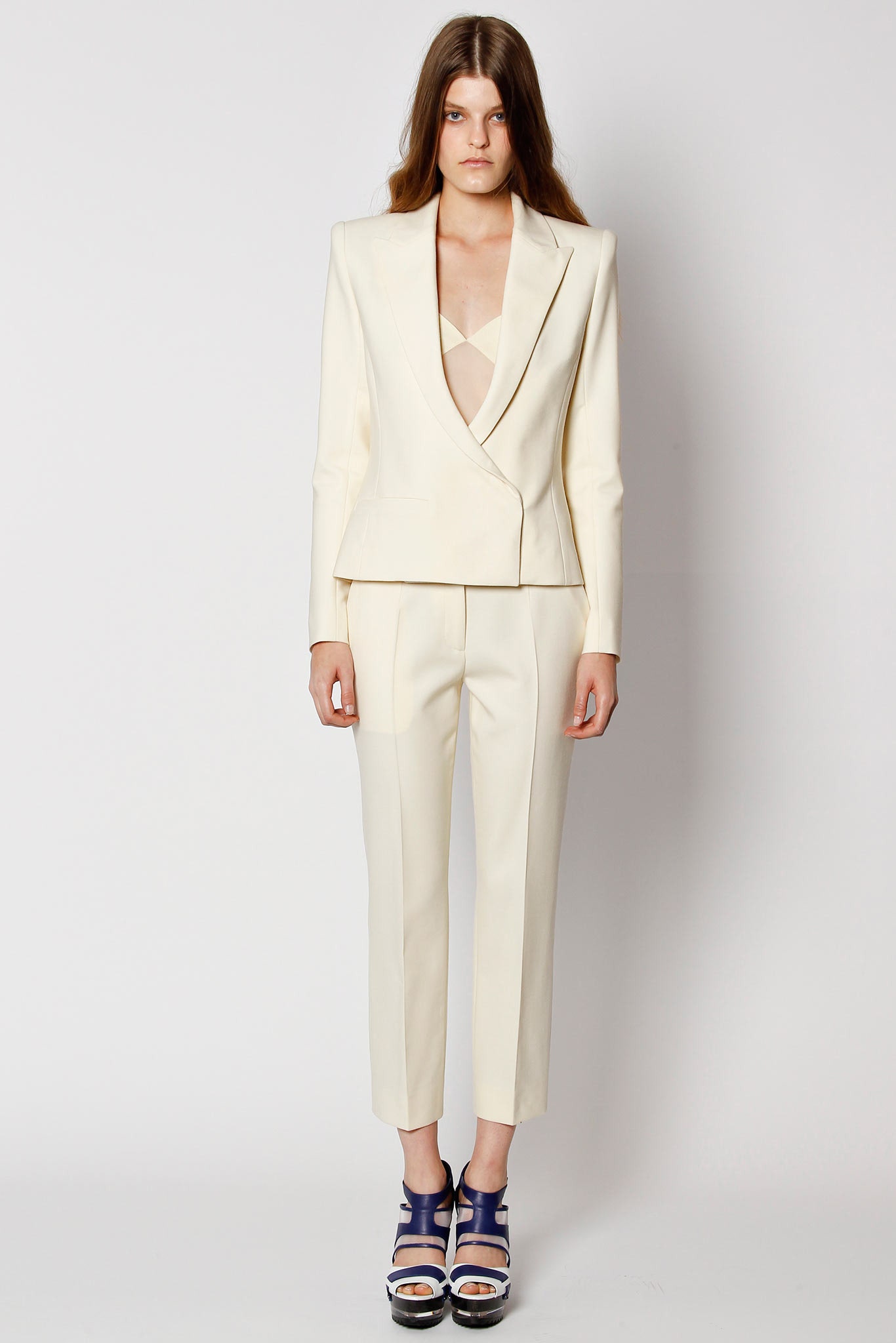 white tailored suit with blue shoes