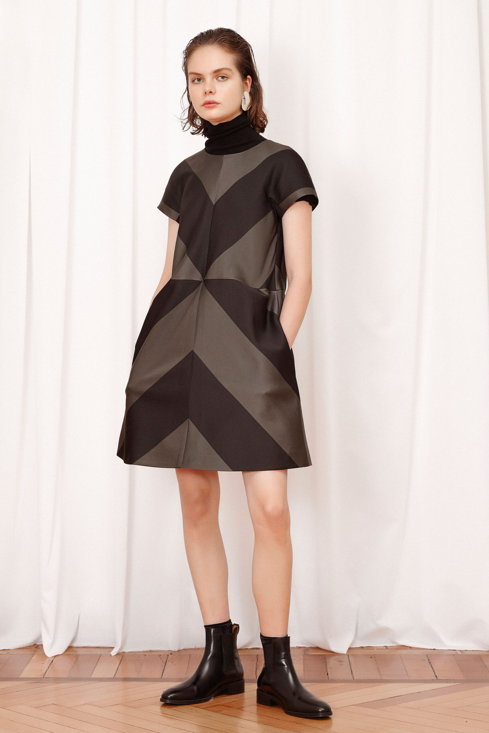 black leather short-sleeve high-neck fitted color-blocked pockets dress