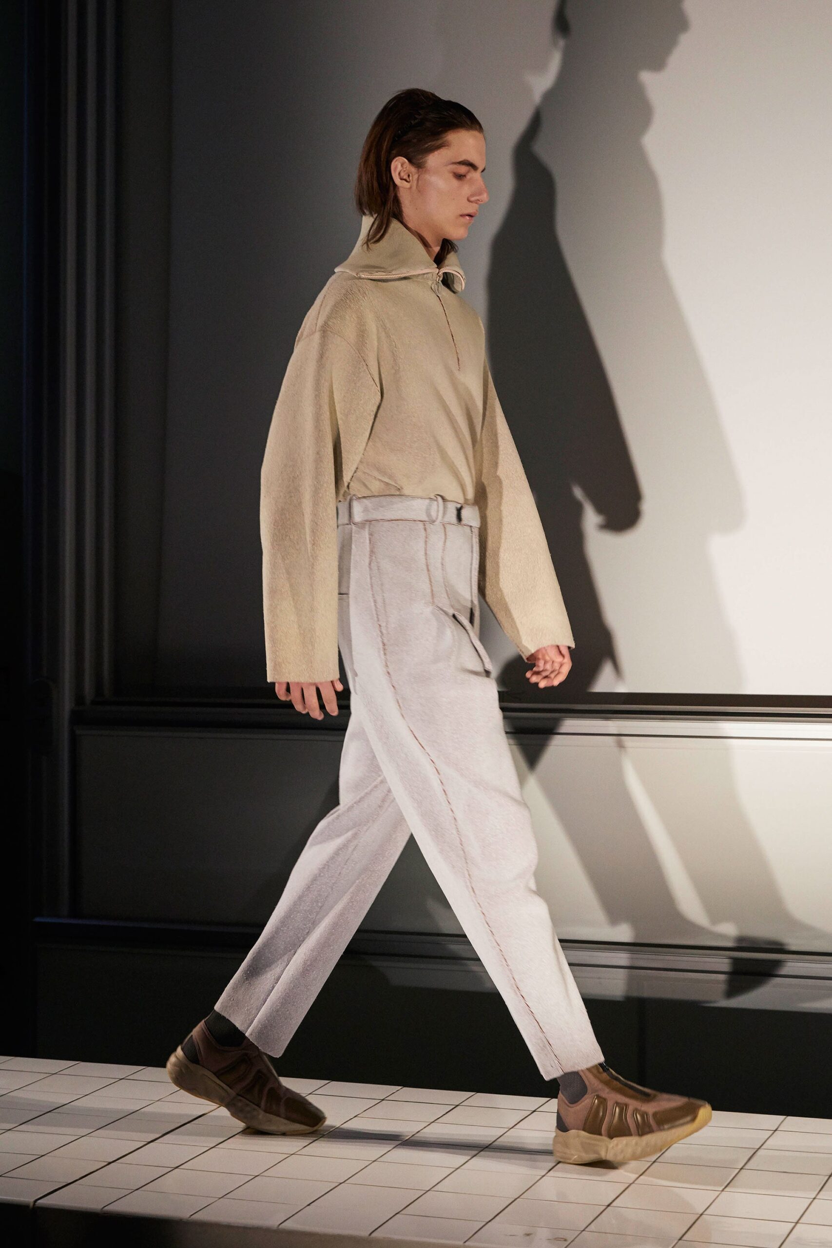beige relaxed top with gray tailored pants