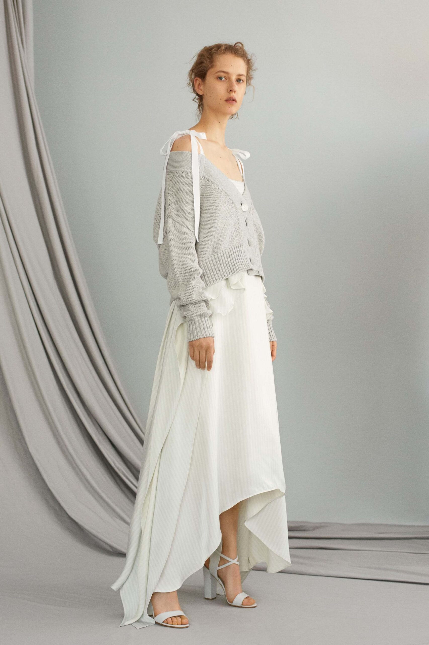 gray cardigan white asymmetric skirt