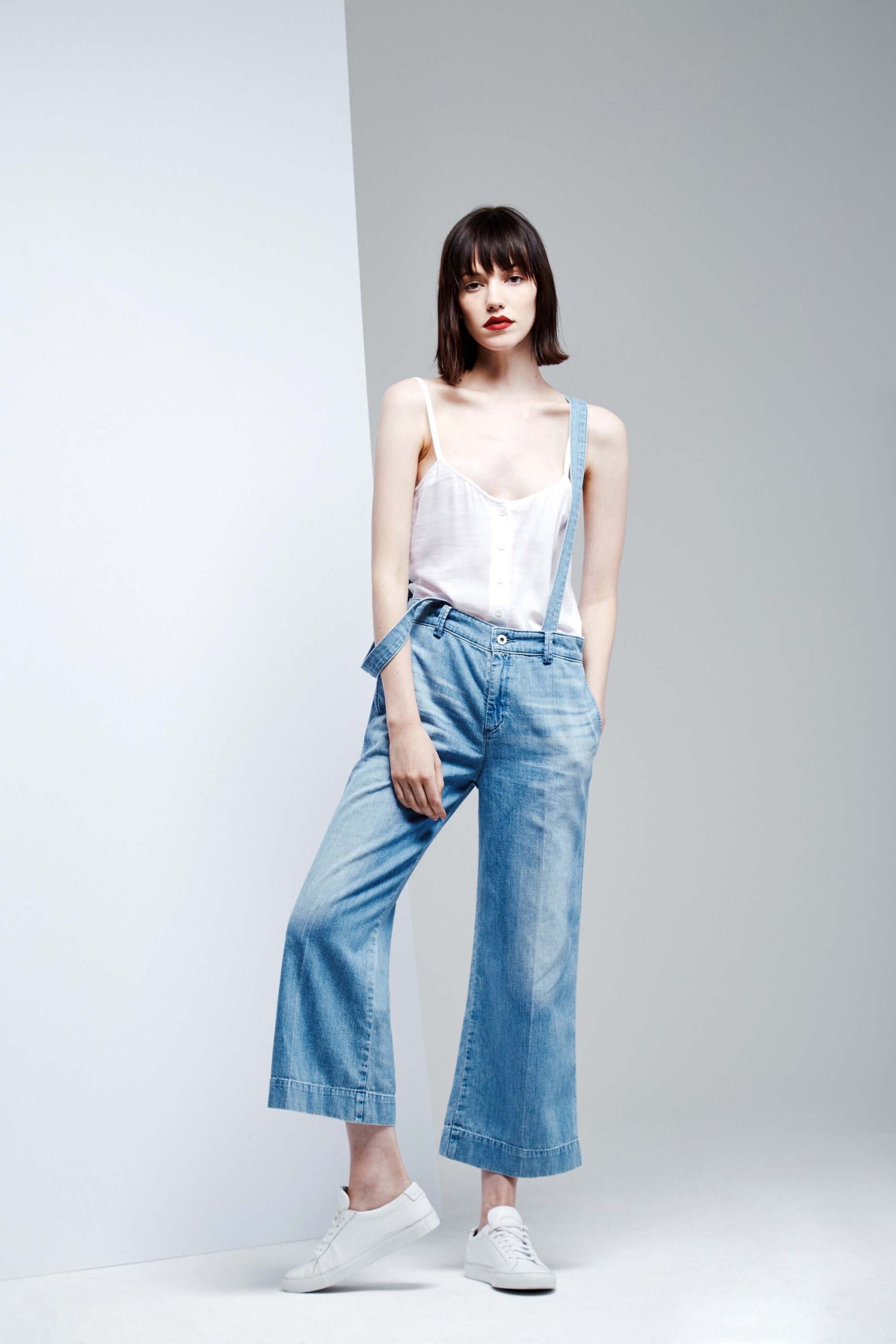 white sleeveless top with blue wide-leg pants