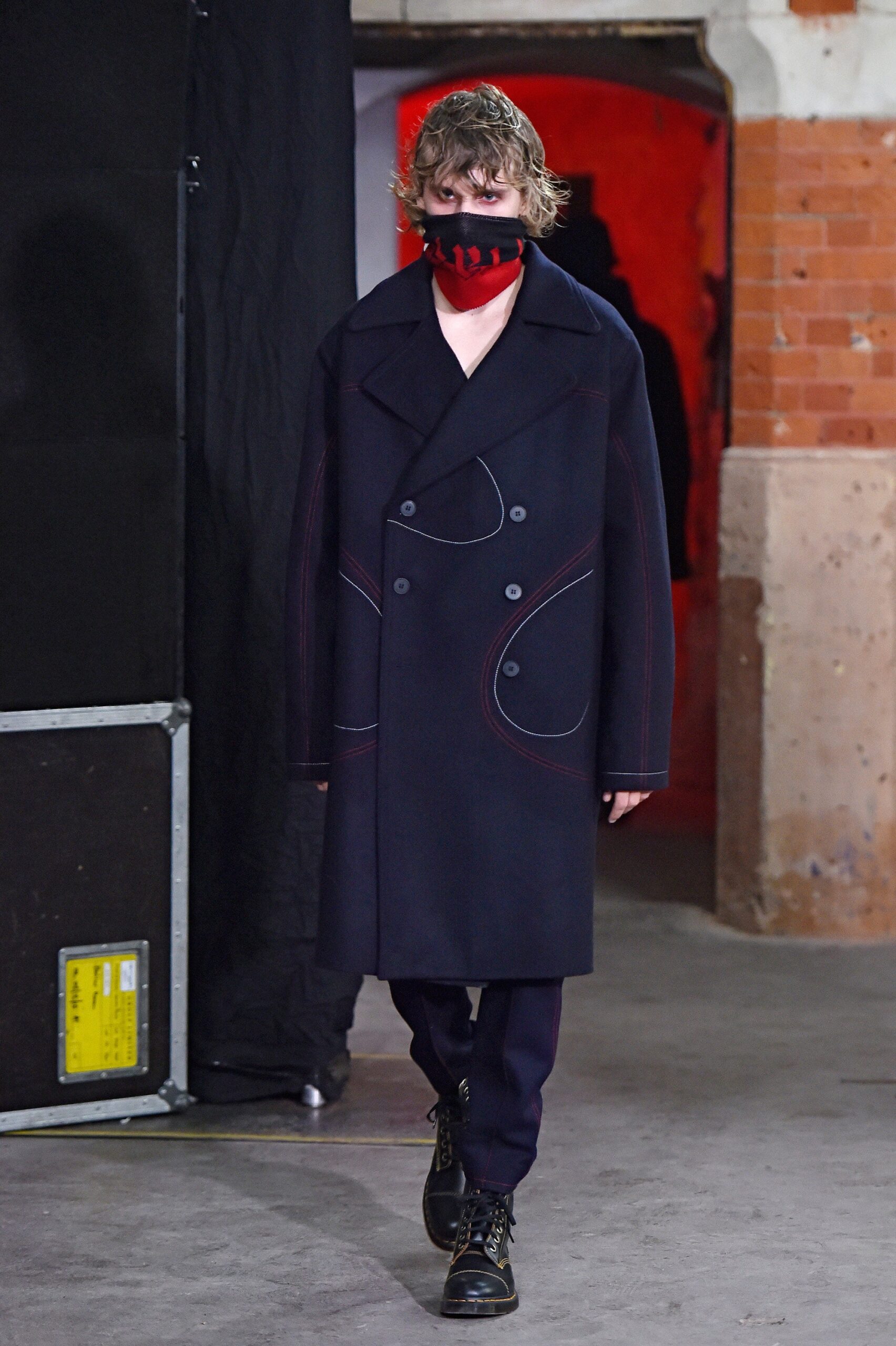 black wool coat with red mask