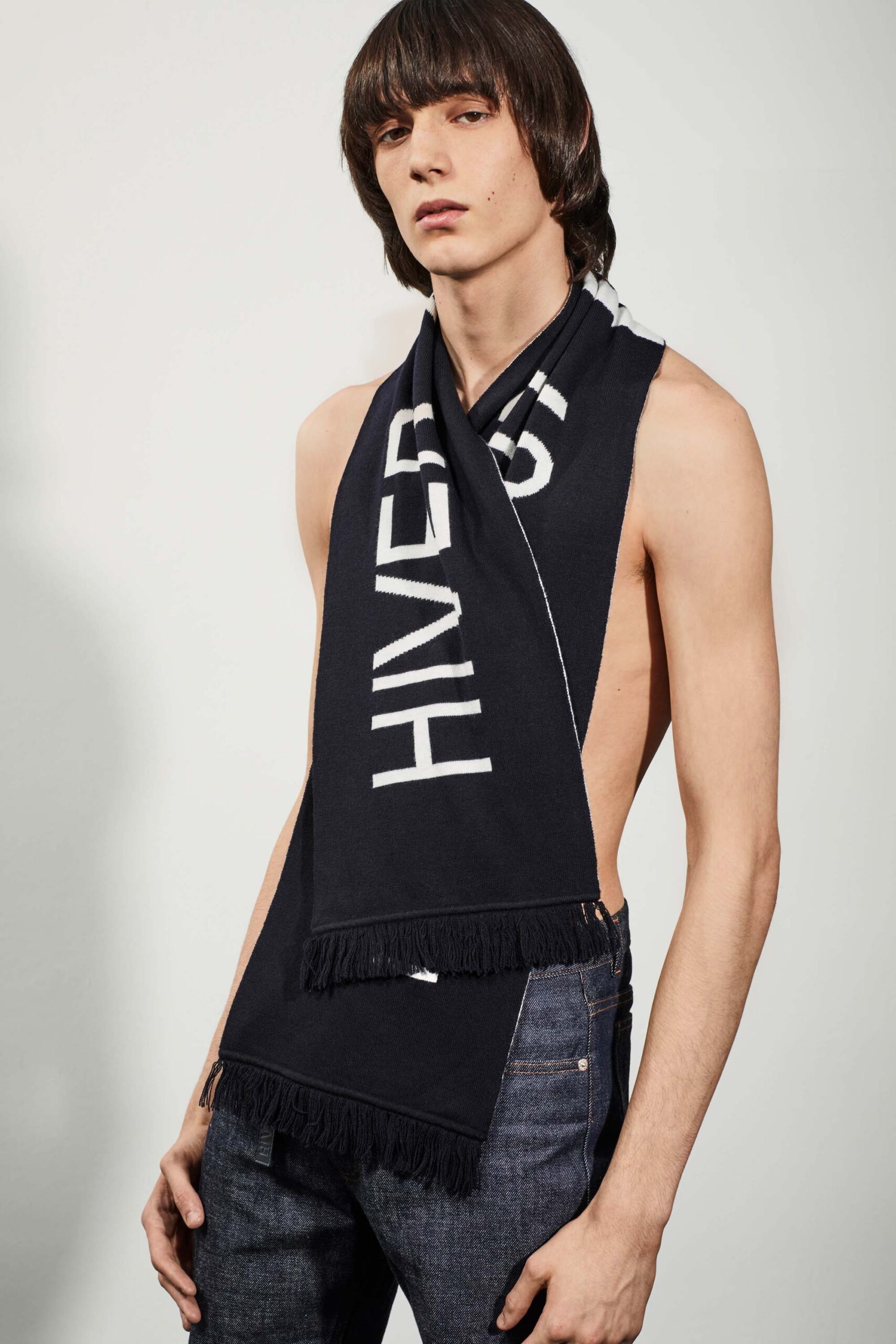 black and white fringed scarf with blue jeans