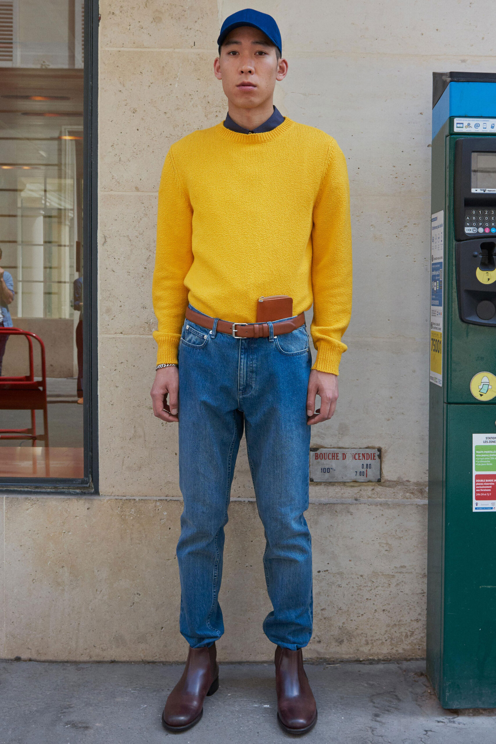 yellow fitted sweater with blue jeans
