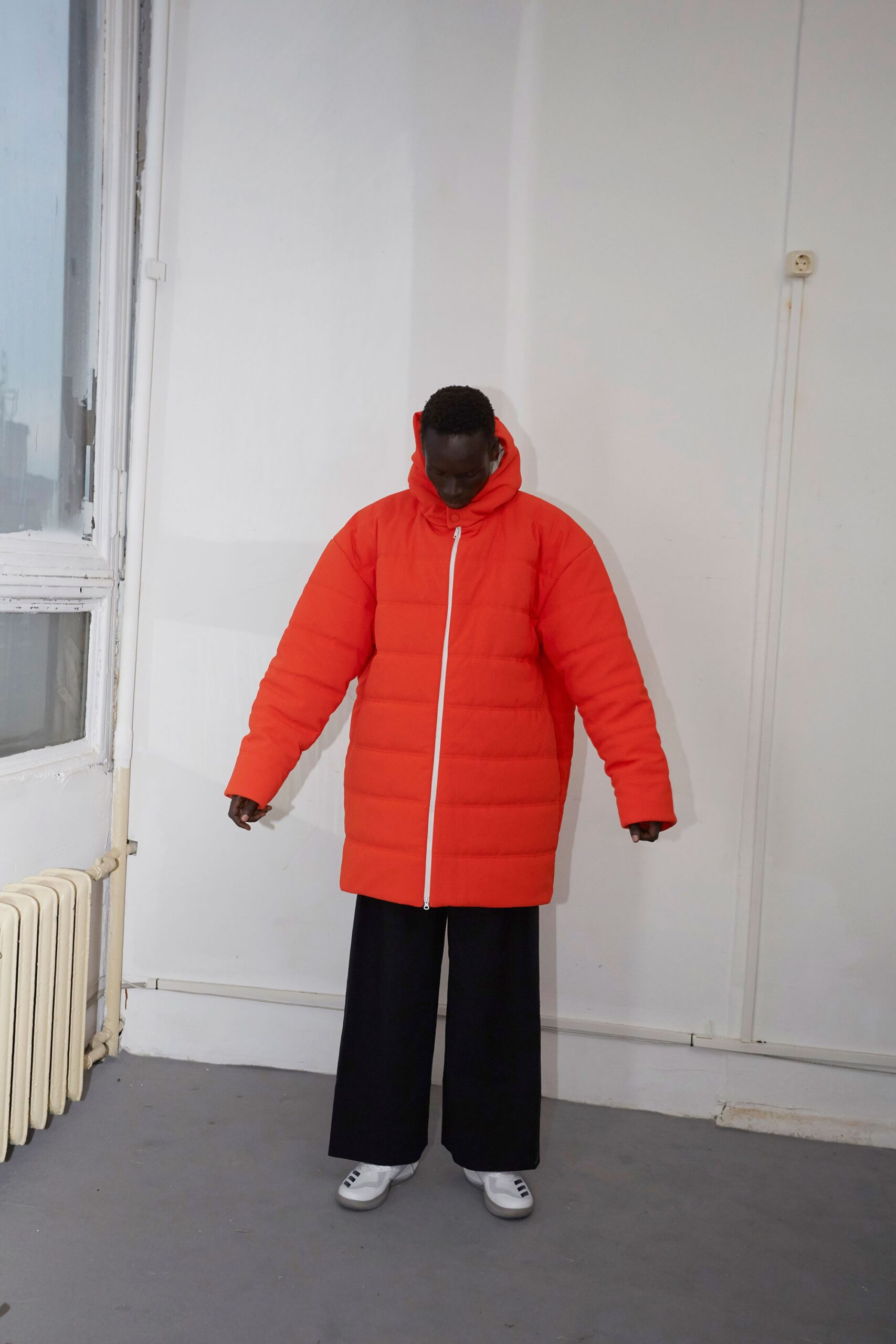 oversized red coat and black pants