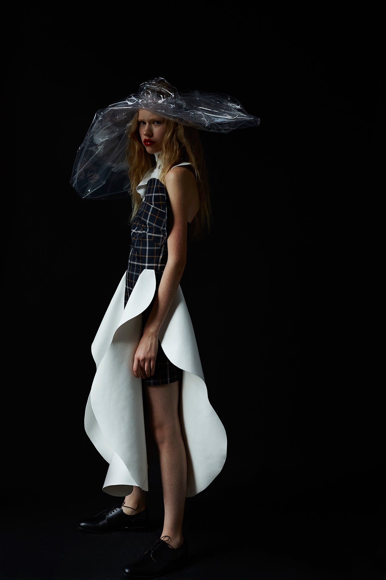 asymmetric black and white dress with oversized hat