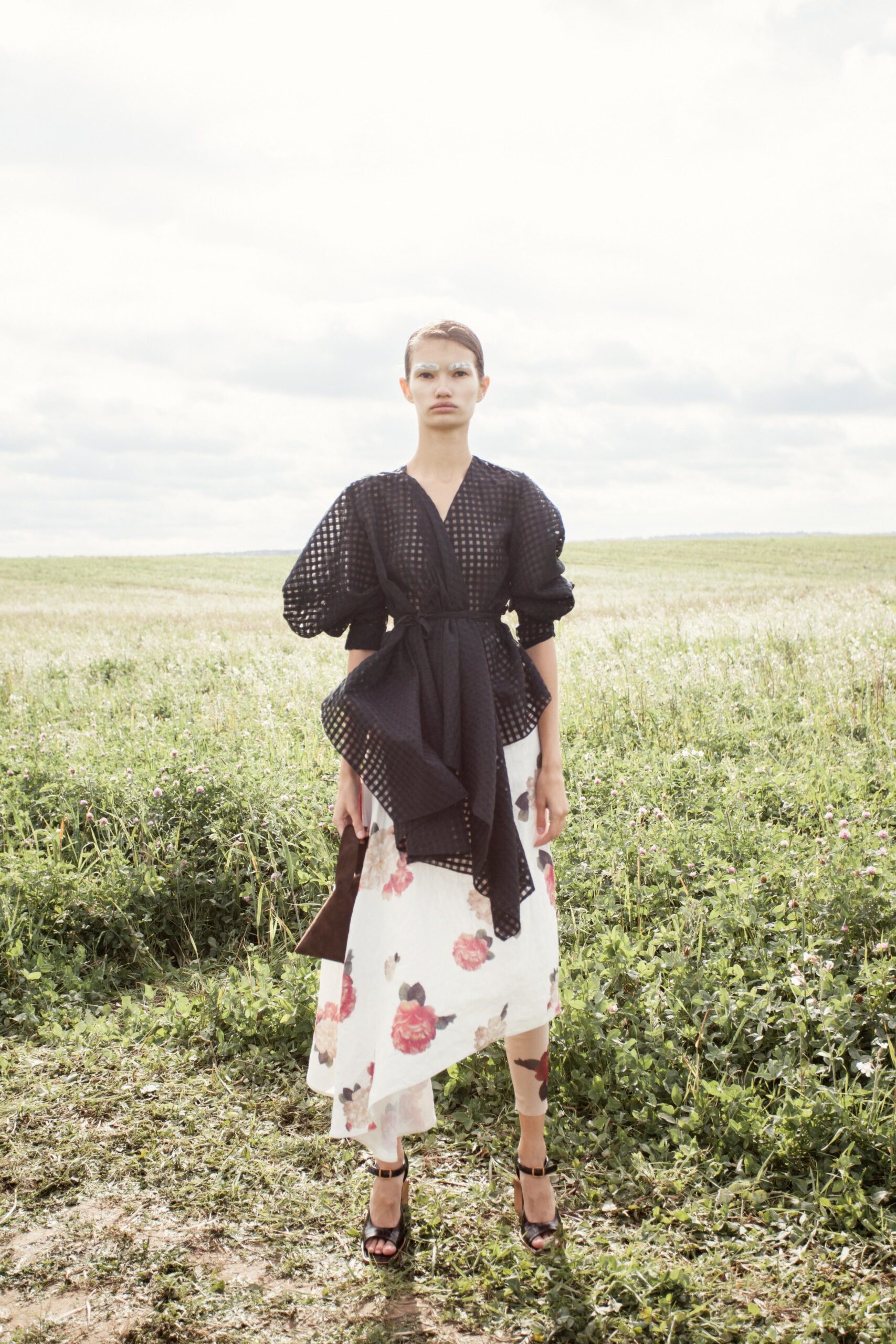 black ruffled blouse and floral skirt