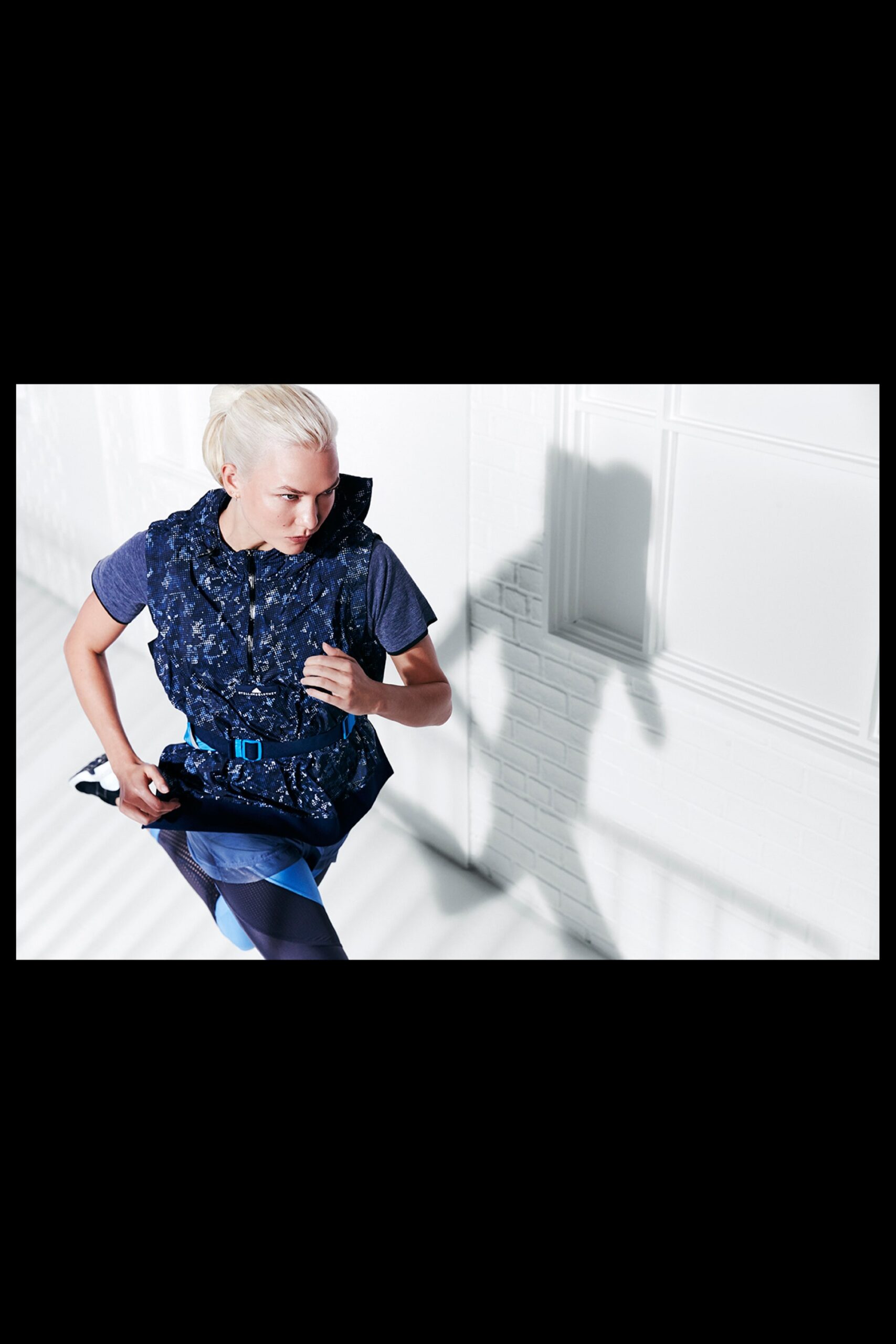 blue fitted vest with gray t-shirt