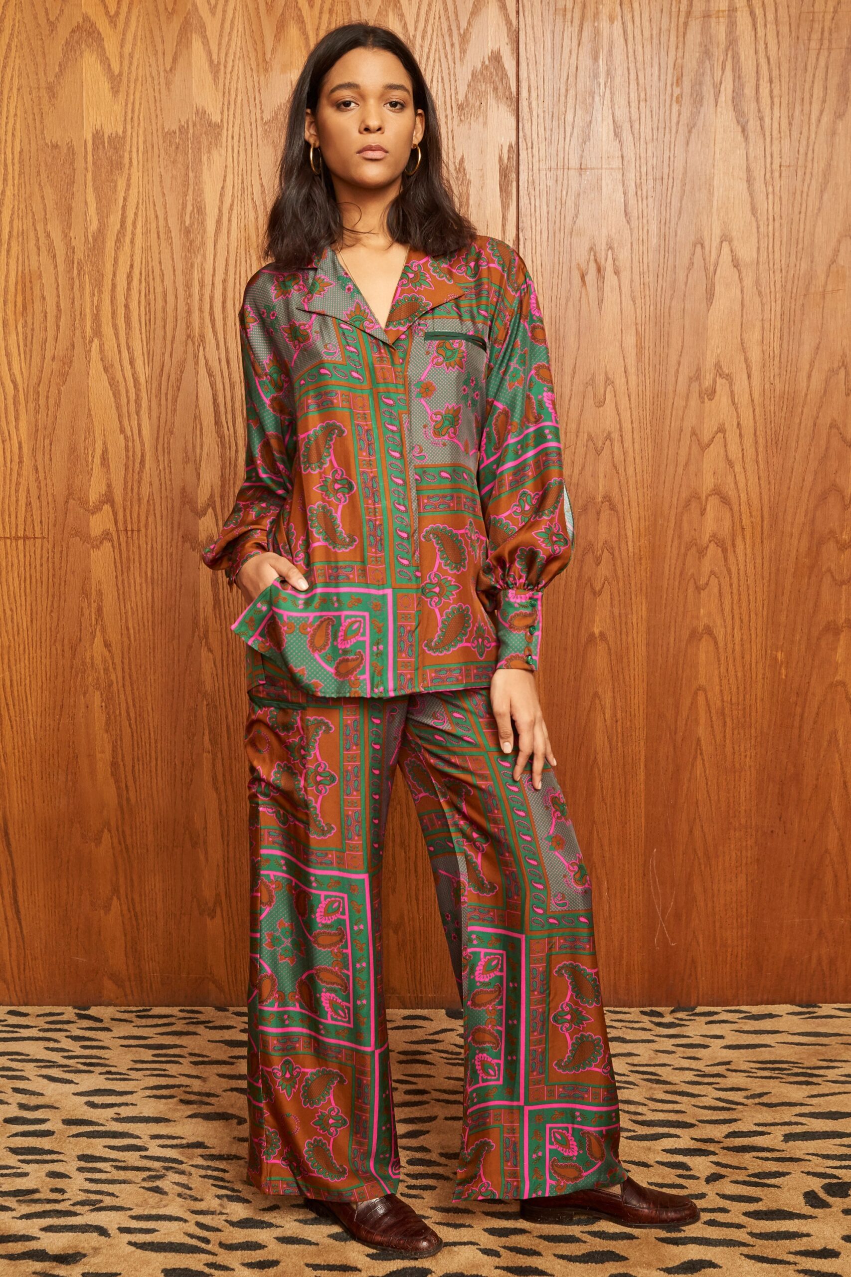 A relaxed-fit printed silk top with long sleeves and matching pants, featuring a vibrant design.
