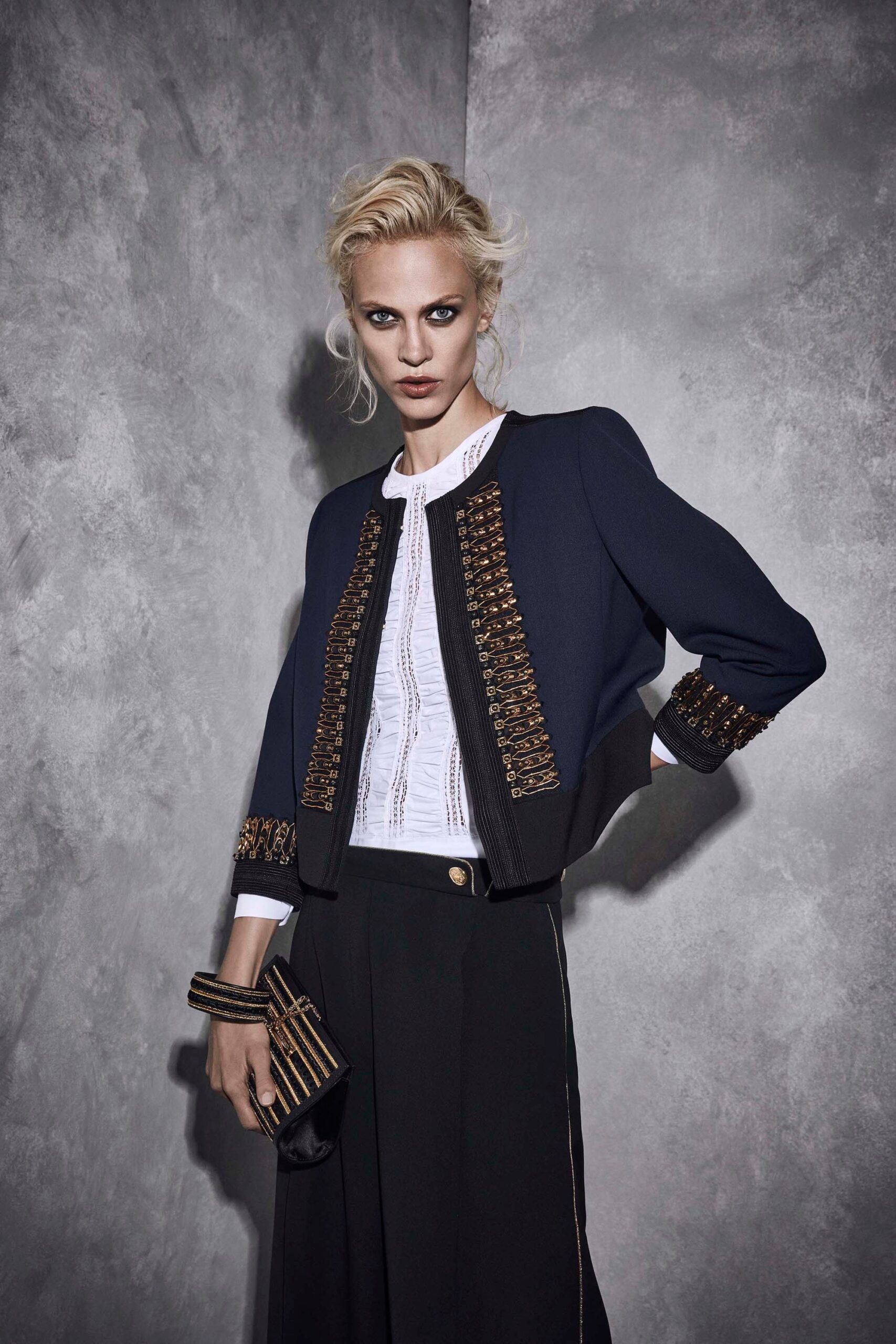 fitted black and blue jacket with blouse and tailored pants