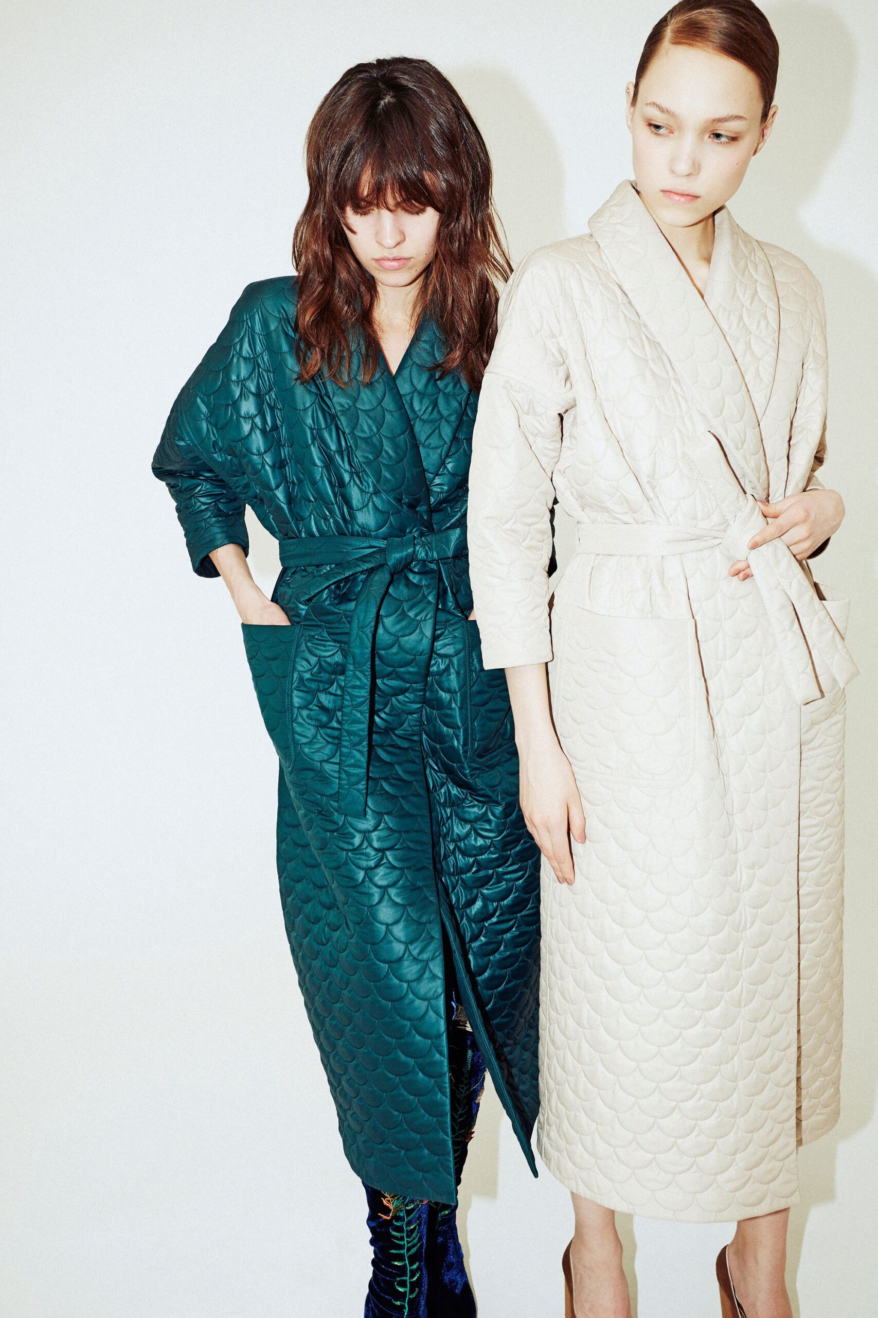 teal and beige quilted coats