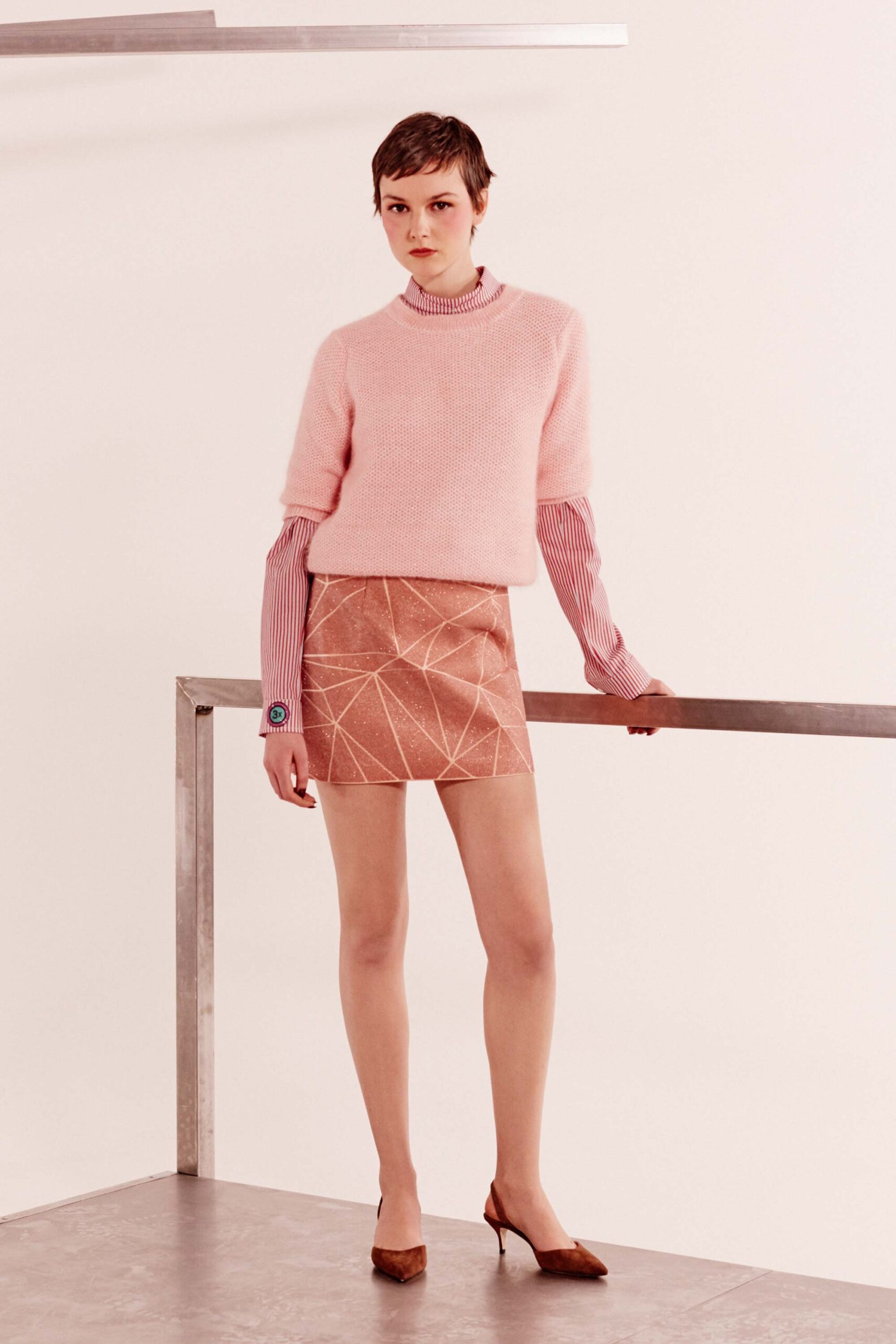 pink fitted sweater and mini skirt