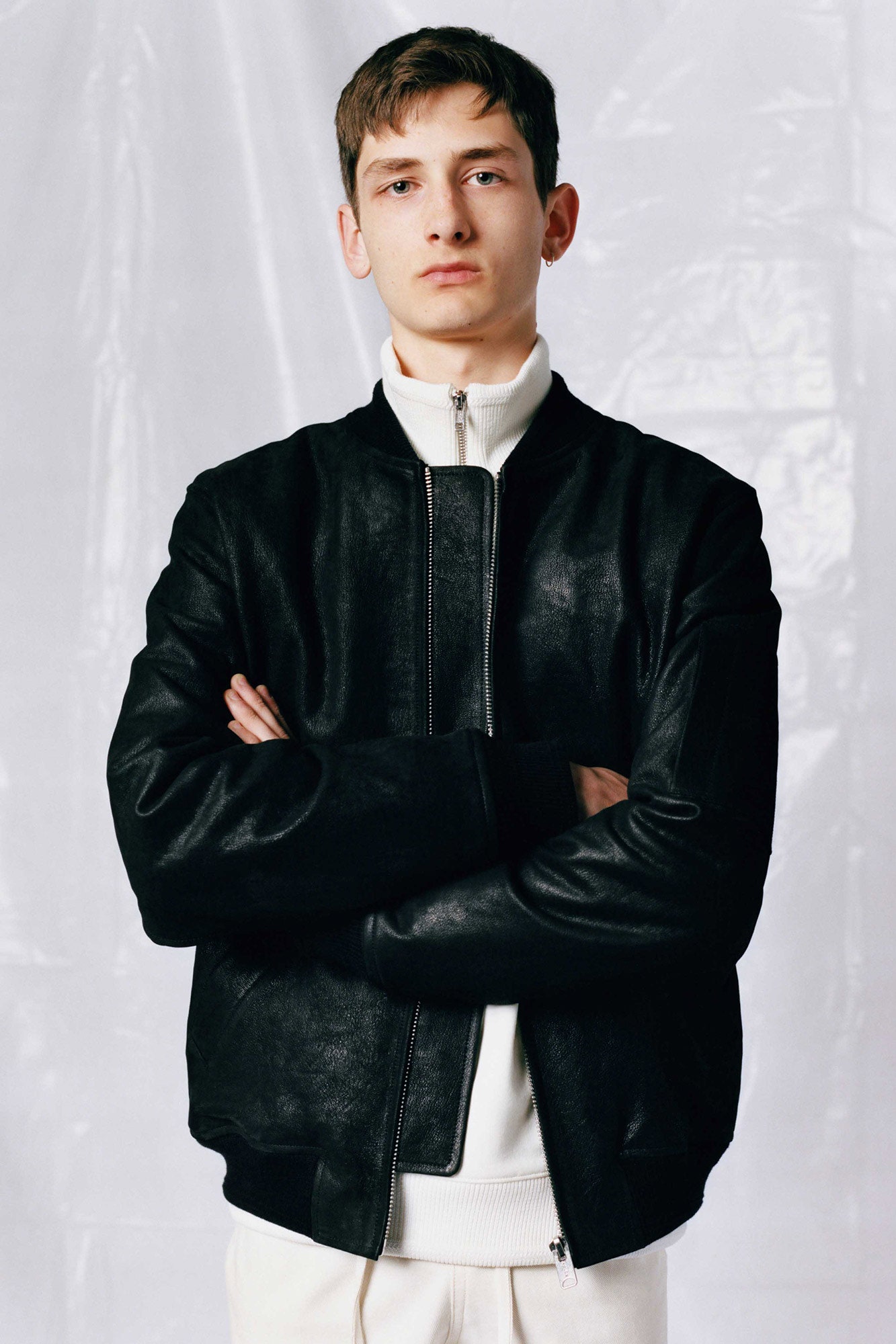 black leather jacket and white top