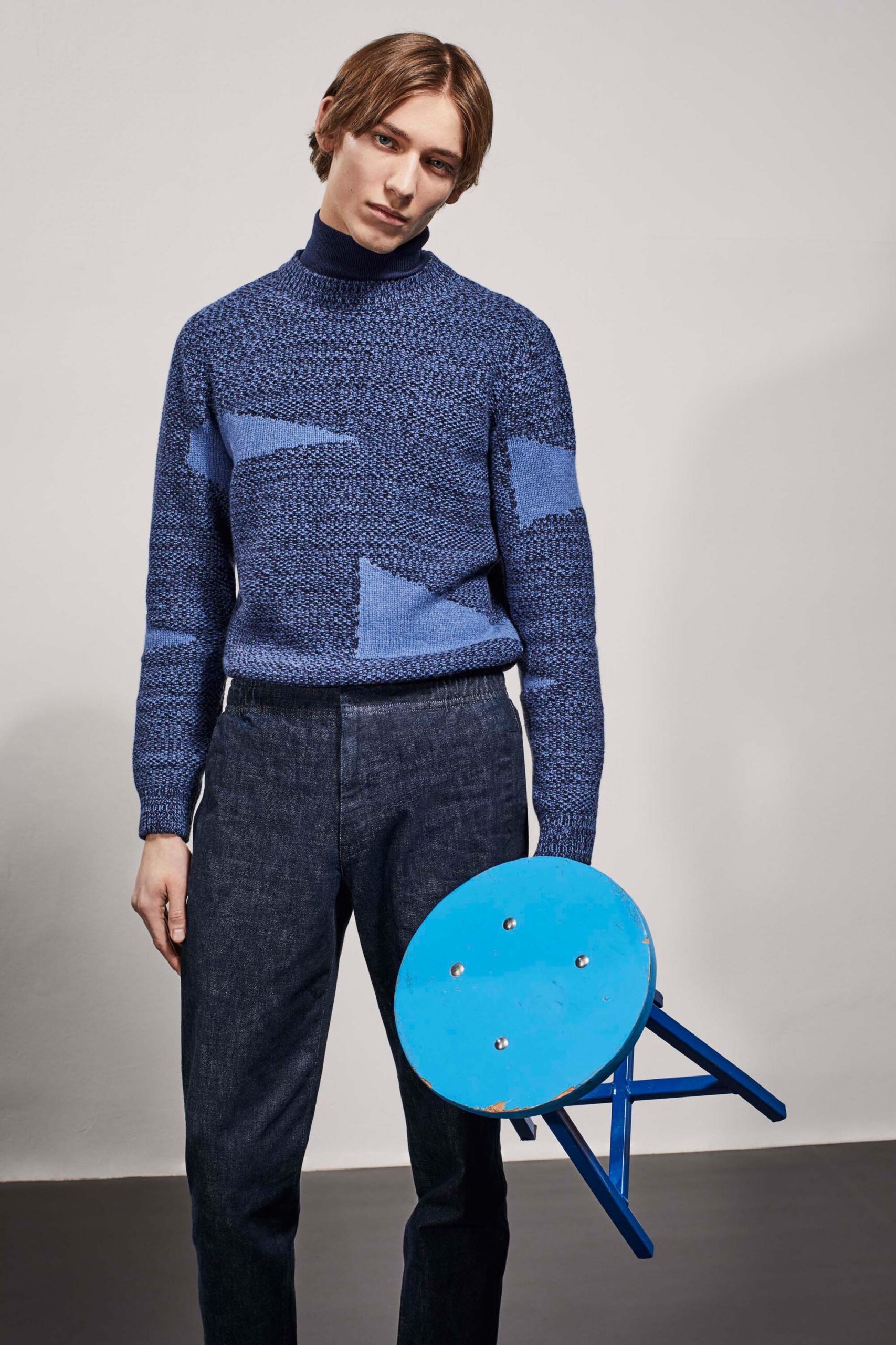 blue wool sweater and tailored pants