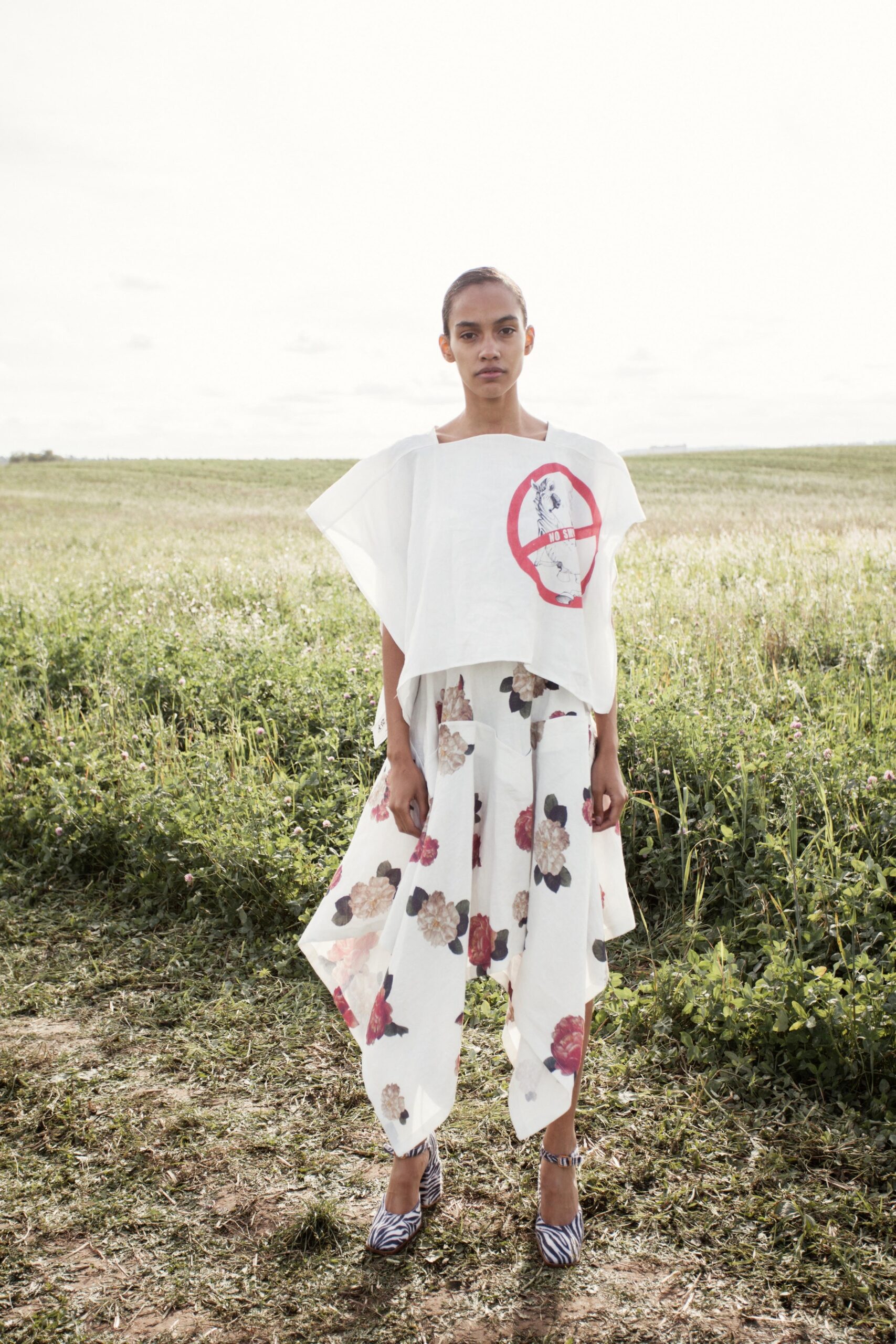 white relaxed top with printed pants
