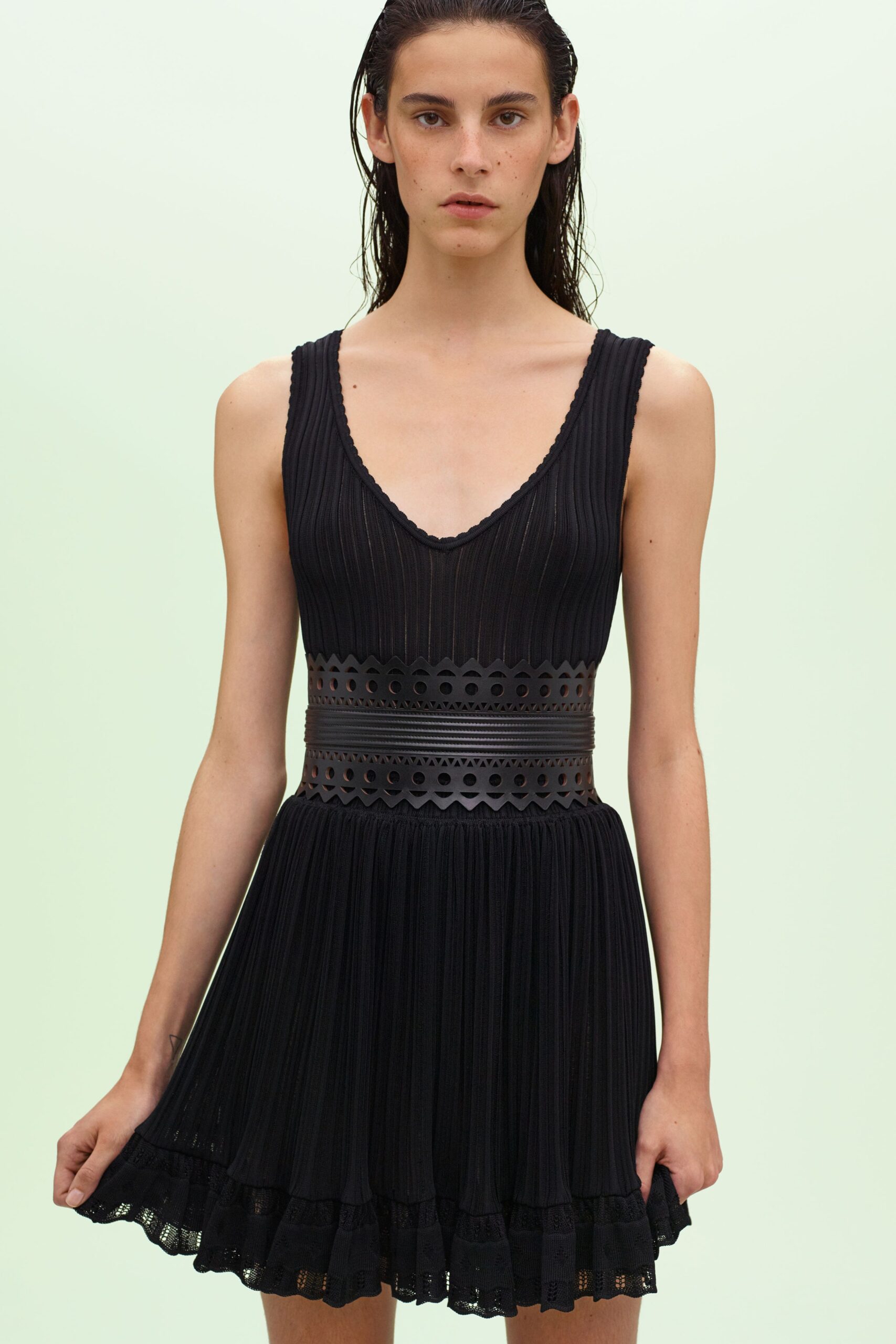 fitted black sleeveless mini dress