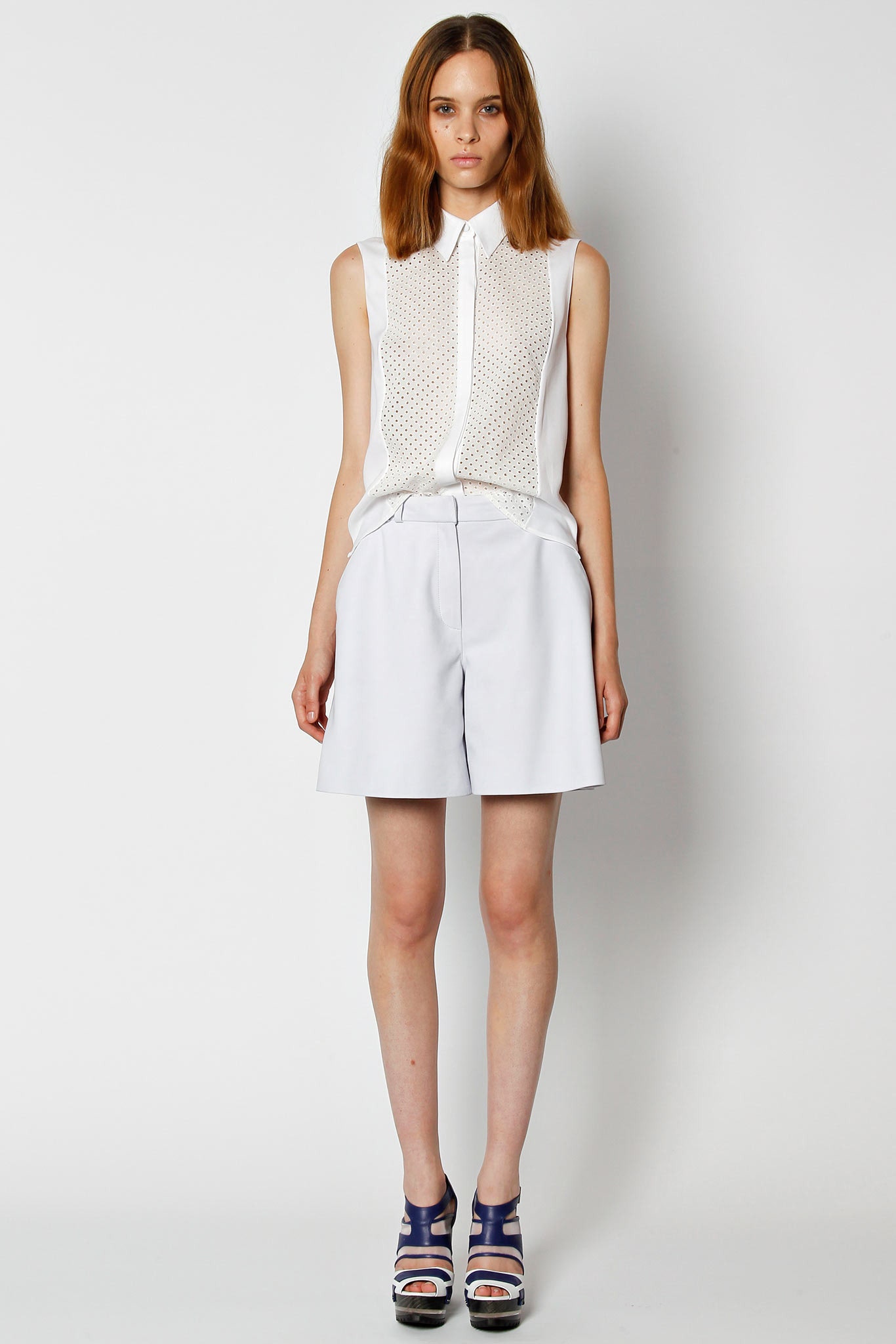 white fitted sleeveless top and gray shorts