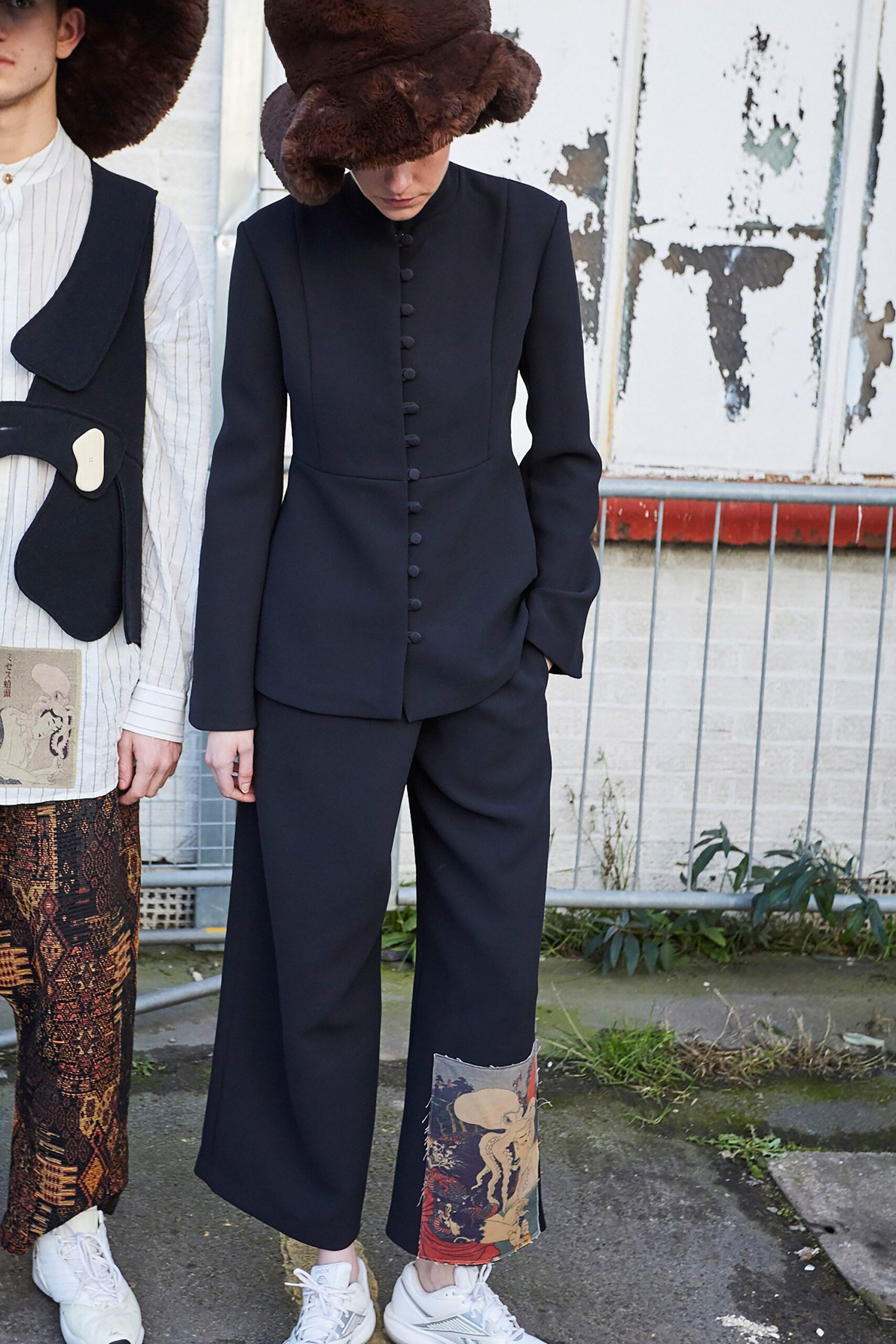 black tailored blazer and relaxed pants