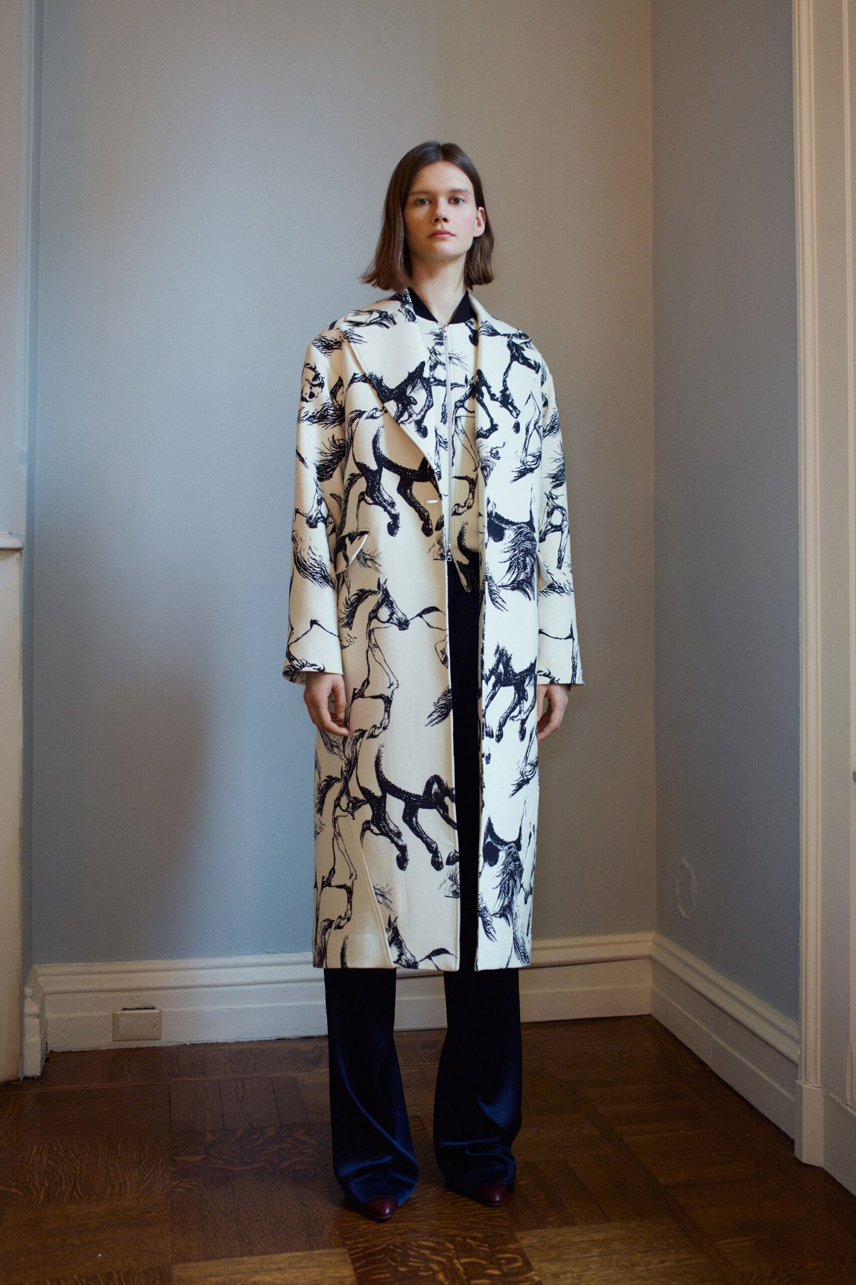 white printed coat with navy pants