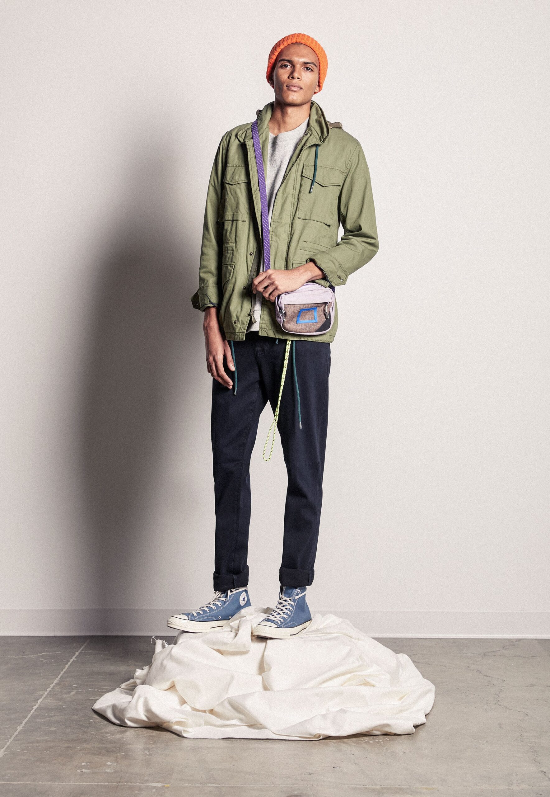 green relaxed jacket with navy pants